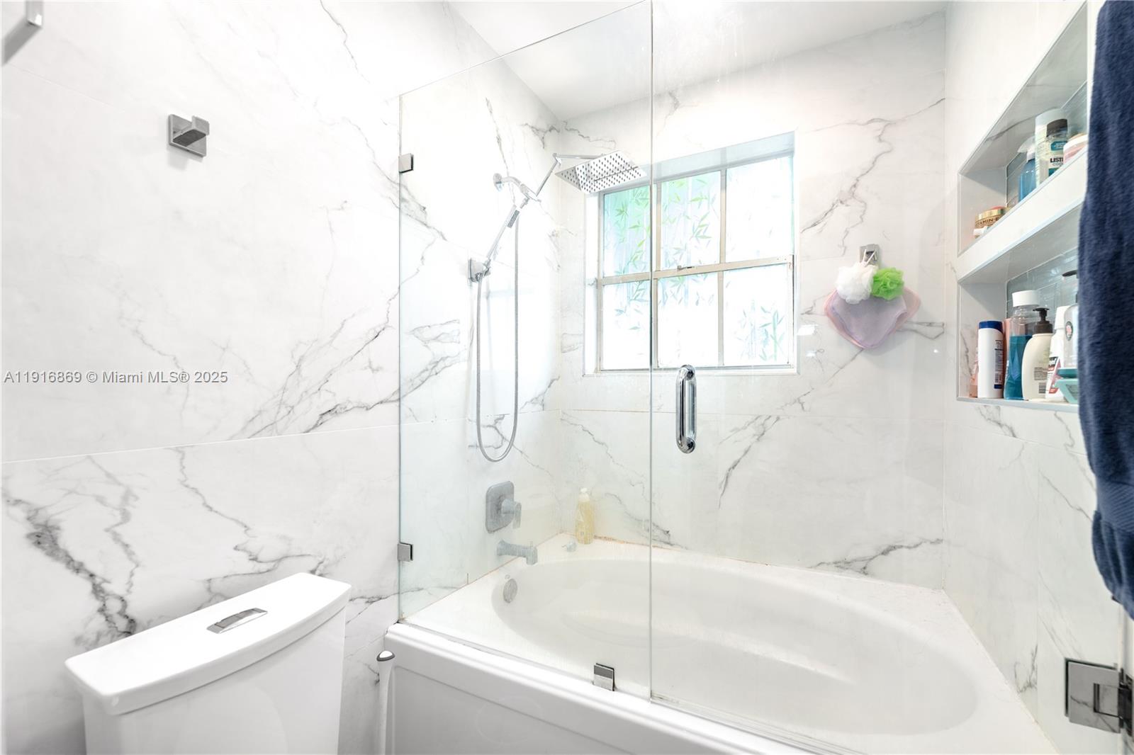 9985 Southwest 118th Place Miami, FL 33186 - Photo 24 of 30 a bathroom with a sink and a bathtub