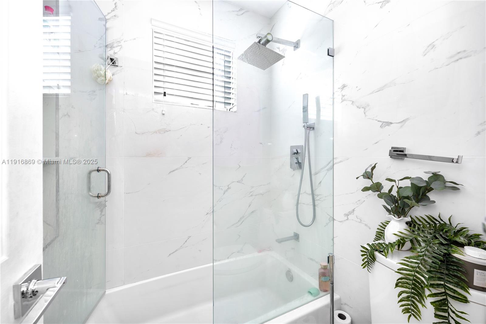 9985 Southwest 118th Place Miami, FL 33186 - Photo 26 of 30 a bathroom with a shower