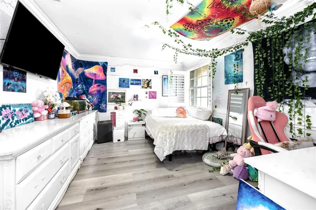 a view of a patio with a table and chairs under an umbrella