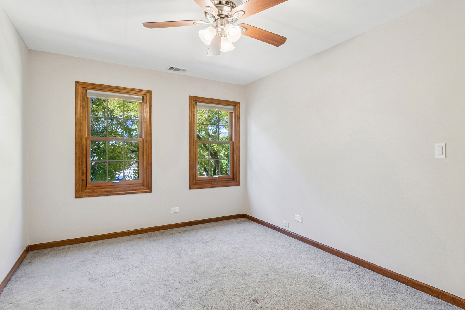 2230 Keim Road Naperville, IL 60565 - Photo 20 of 33 an empty room with a window and a fan