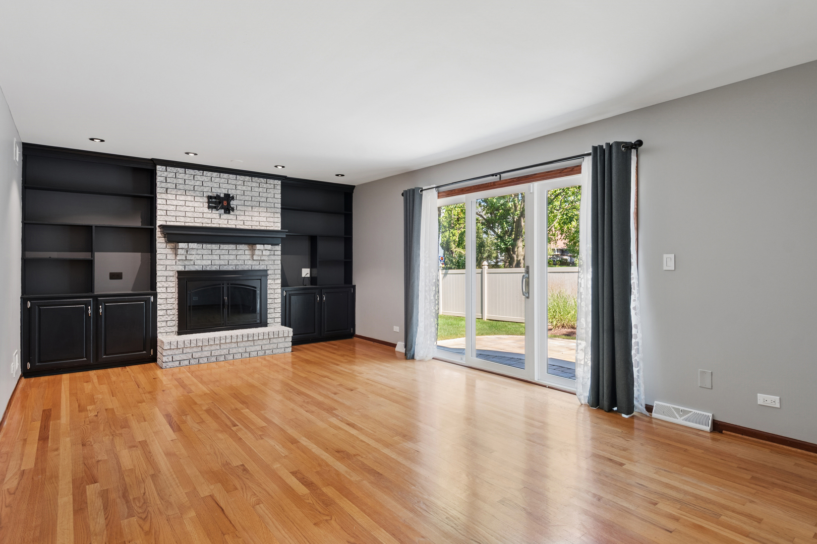 2230 Keim Road Naperville, IL 60565 - Photo 8 of 33 a view of an empty room with a window and a kitchen