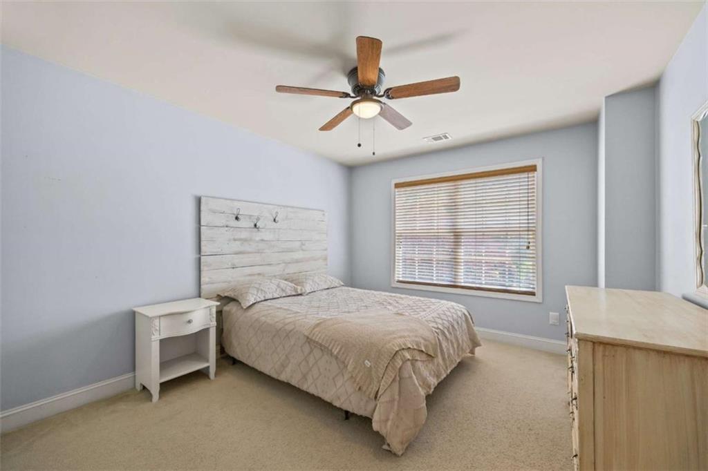 42 Pintail Lane Jefferson, GA 30549 - Photo 16 of 42 a bedroom with a bed dresser and a window