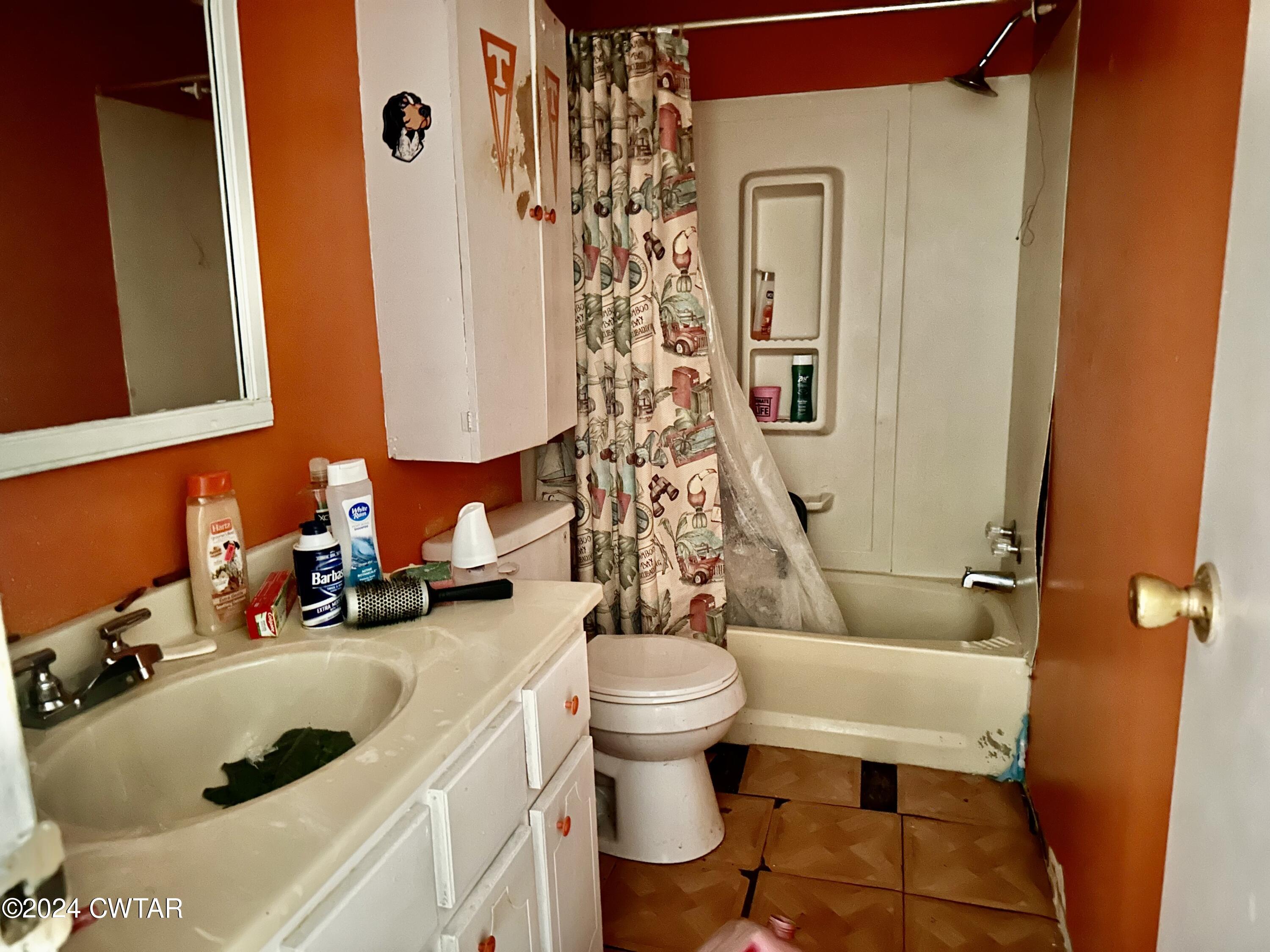 891 Dean Hill Road Hornbeak, TN 38232 - Photo 10 of 12 a bathroom with a sink toilet and shower