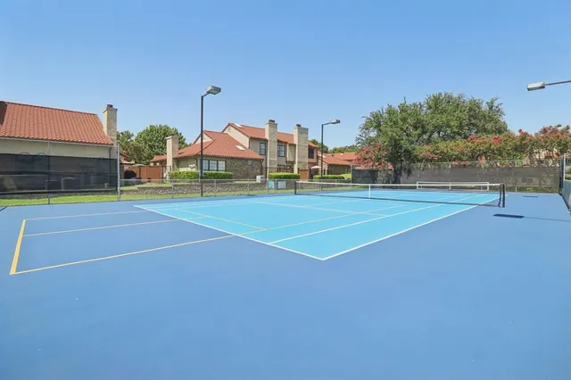 a view of an outdoor space and tennis court