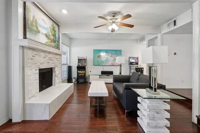a living room with furniture and a fireplace