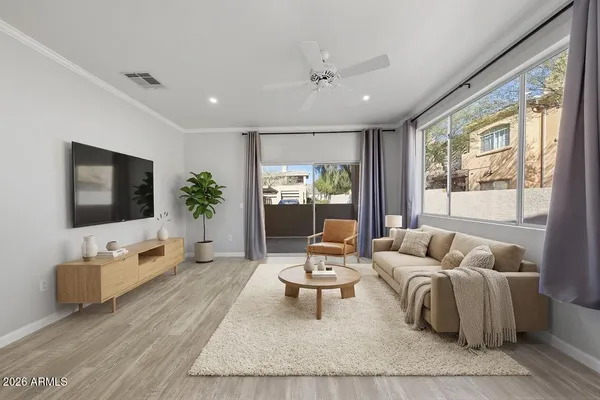 a living room with furniture and a flat screen tv