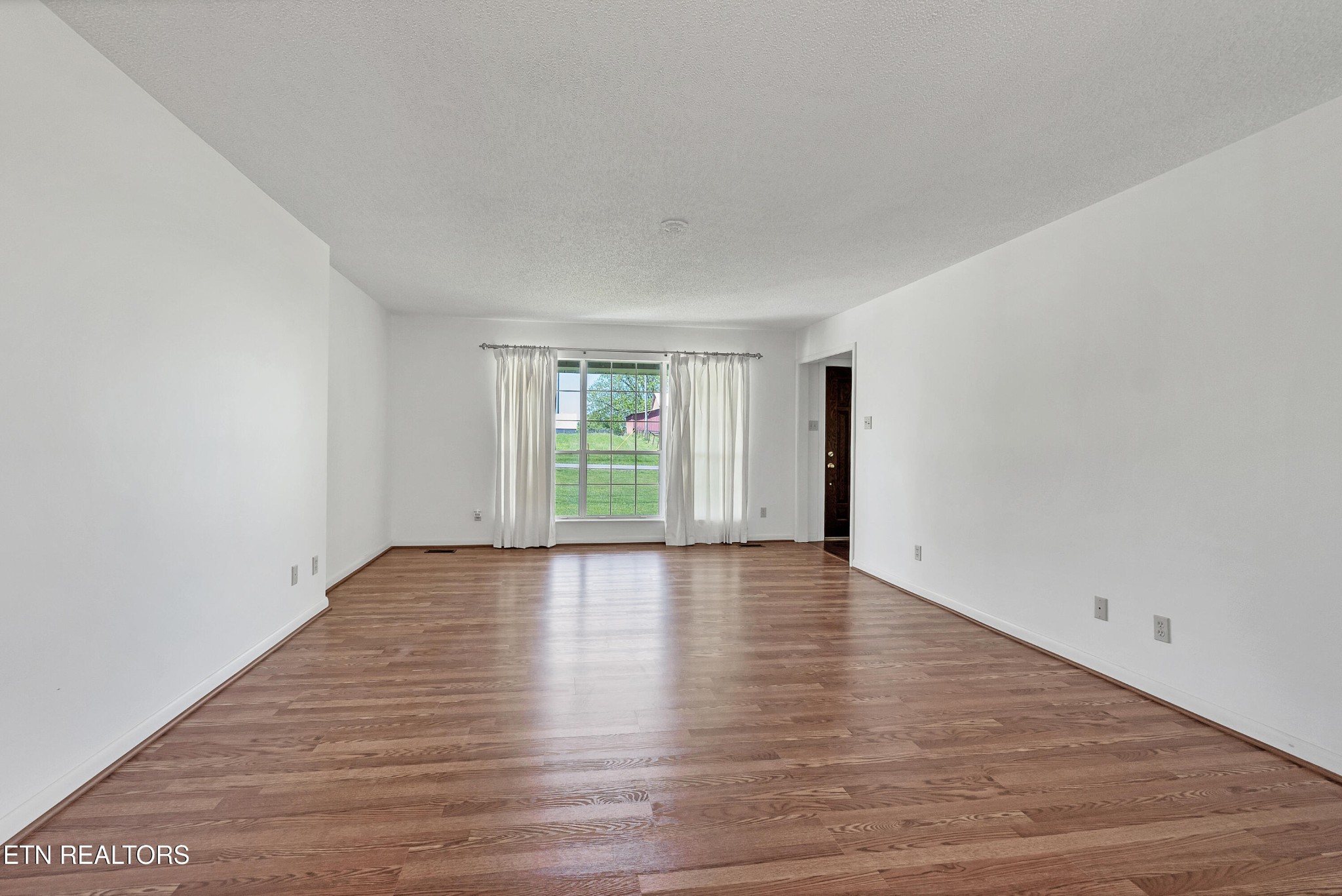 2036 Little Best Road Maryville, TN 37803 - Photo 38 of 54 a view of an empty room with wooden floor and a window