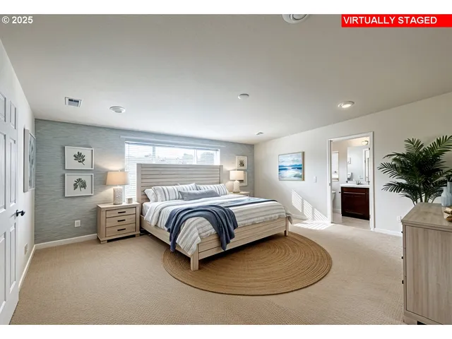 a bedroom with a bed and a large window