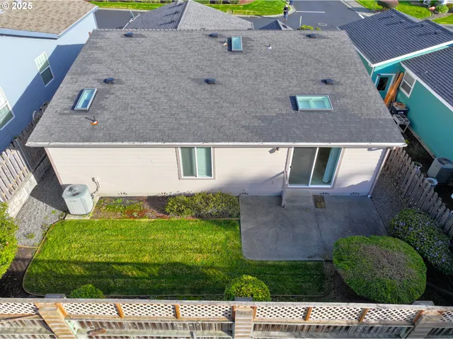 a view of house with a yard