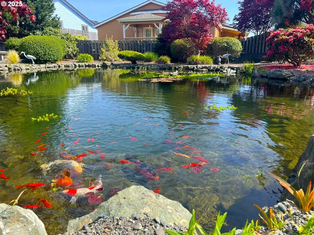 a kitchen with stainless steel appliances white cabinets and a refrigerator