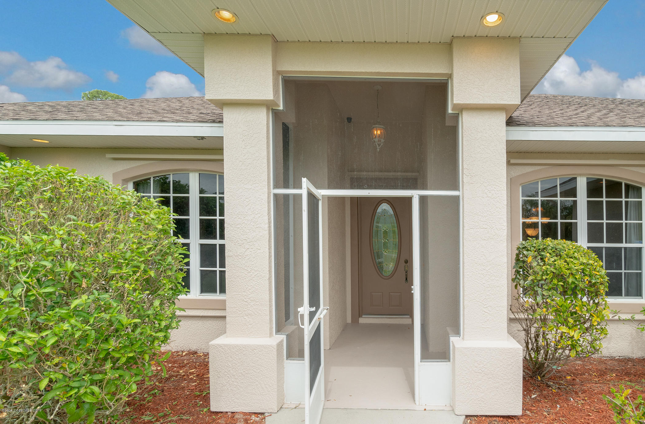 4035 Hield Road Northwest Palm Bay, FL 32907 - Photo 5 of 47 Covered Entryway