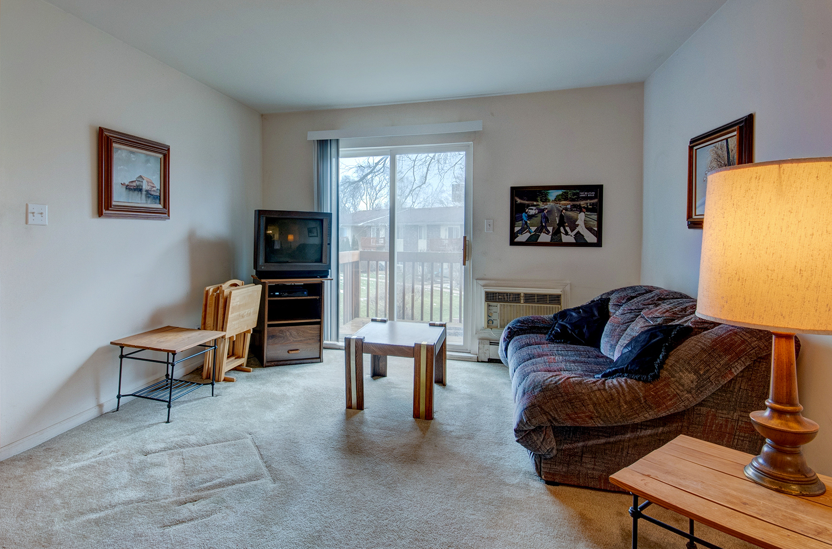 2100 Light Road, Unit 211 Oswego, IL 60543 - Photo 8 of 17 a living room with furniture and a window