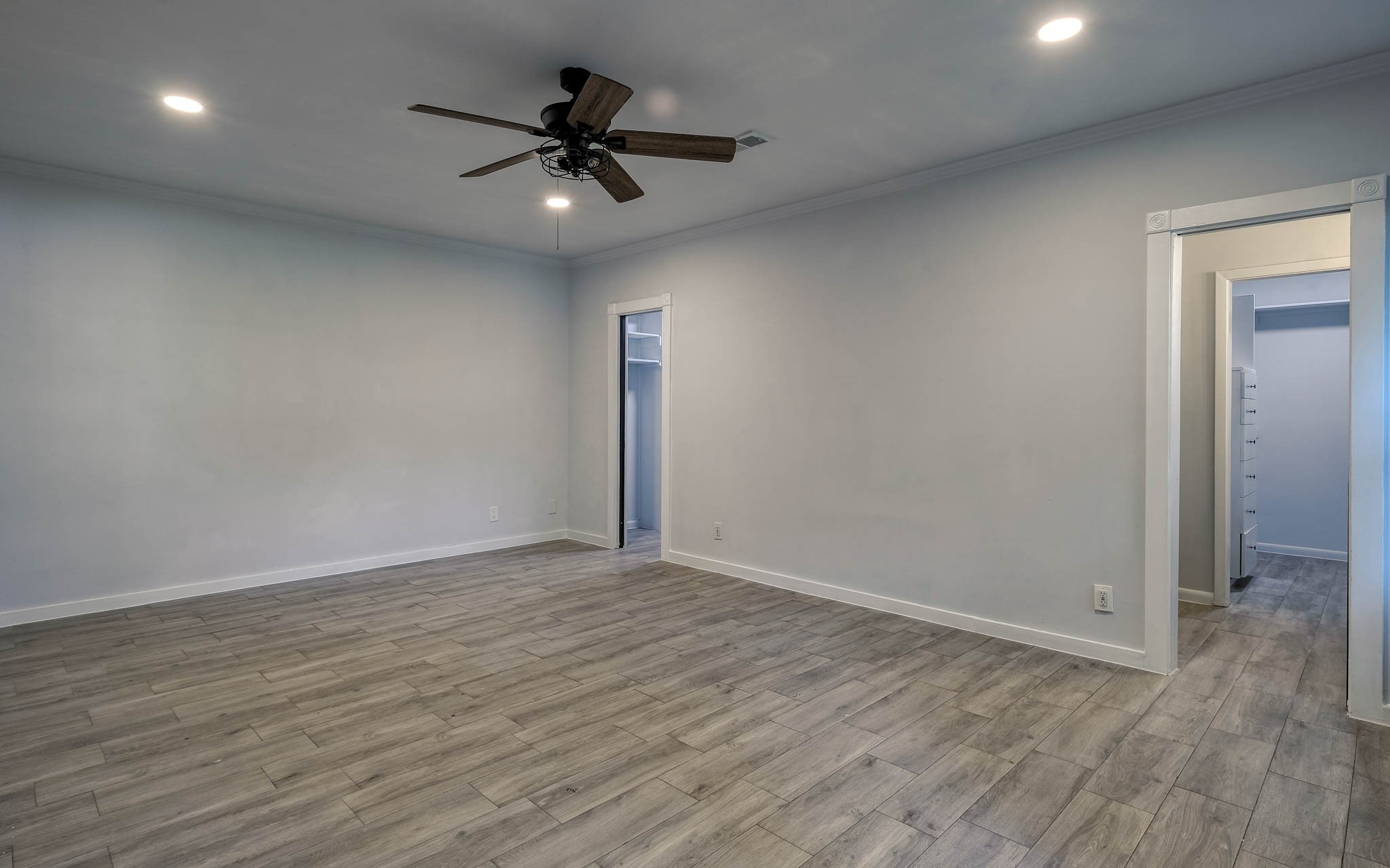 20515 Kickapoo Road Waller, TX 77484 - Photo 18 of 50 a view of an empty room with wooden floor
