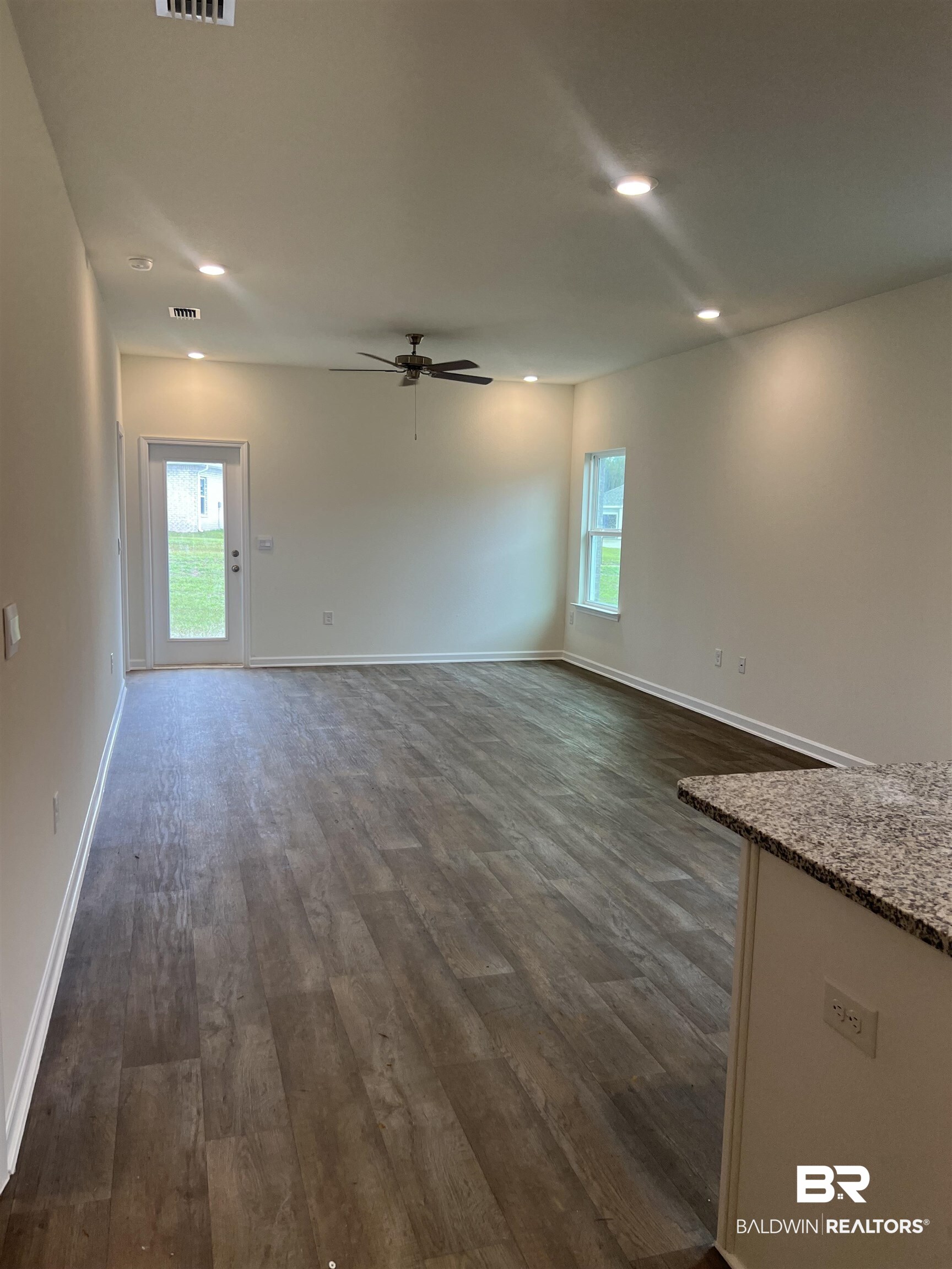 12829 Patriot Way Daphne, AL 36527 - Photo 18 of 38 Unfurnished room featuring dark wood-type flooring and ceiling fan