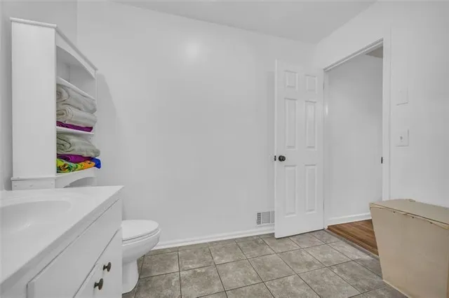 a bathroom with a toilet and a sink