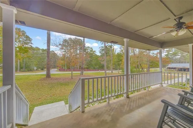 a view of a room with wooden floor and outdoor space