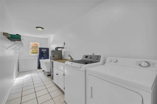 a view of storage and utility room with washer and dryer