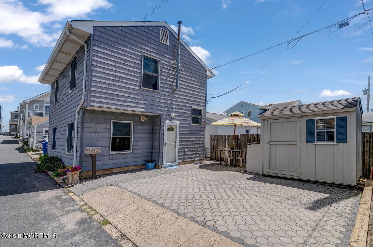 19 Shore Way Lavallette, NJ 08735 - Photo 1 of 38 a front view of a house with a yard