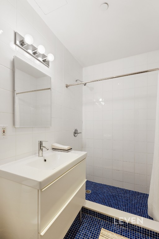 19 Murray Street, Unit LOFT 4 Manhattan, NY 10007 - Photo 10 of 13 a bathroom with a sink a toilet and a mirror