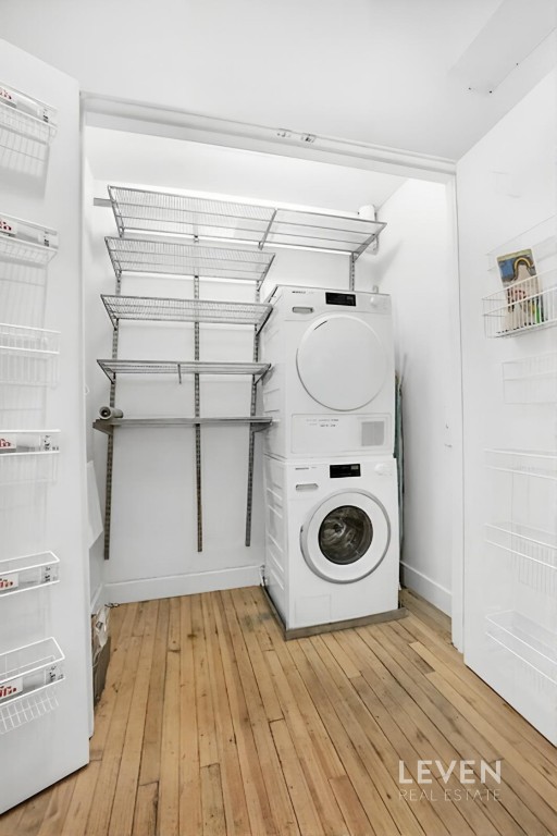 19 Murray Street, Unit LOFT 4 Manhattan, NY 10007 - Photo 12 of 13 a bathroom with a wooden floor and toilet