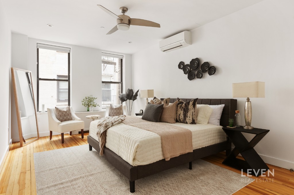 19 Murray Street, Unit LOFT 4 Manhattan, NY 10007 - Photo 7 of 13 a bedroom with bed and window