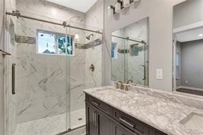 6814 Dumble Street, Unit A Houston, TX 77021 - Photo 13 of 22 a bathroom with a granite countertop shower sink and mirror