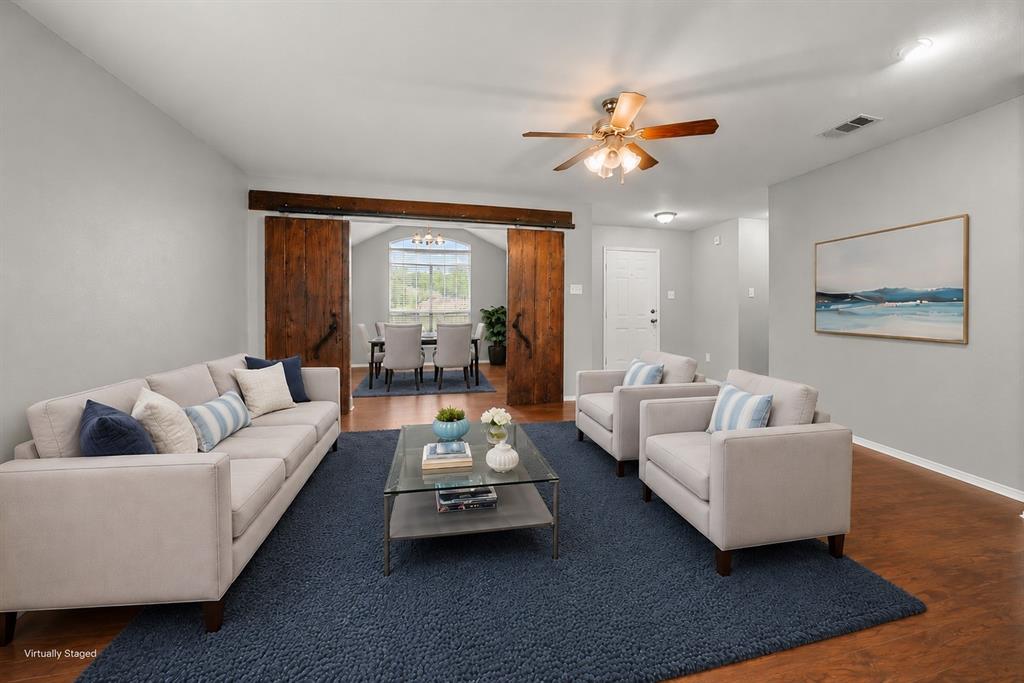 834 Hazel's Way Anna, TX 75409 - Photo 6 of 21 Open-concept living space with wood-finish flooring
