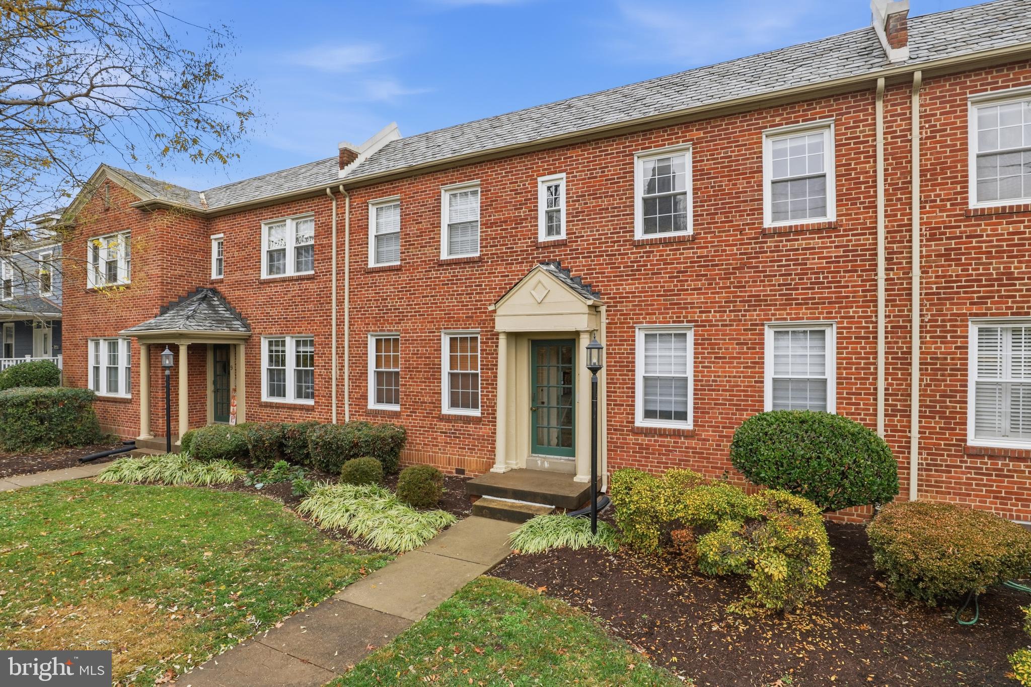 7 Russell Road, Unit D Alexandria, VA 22301 - Photo 1 of 27 a front view of a house with garden