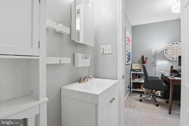 a view of bathroom with dual sinks