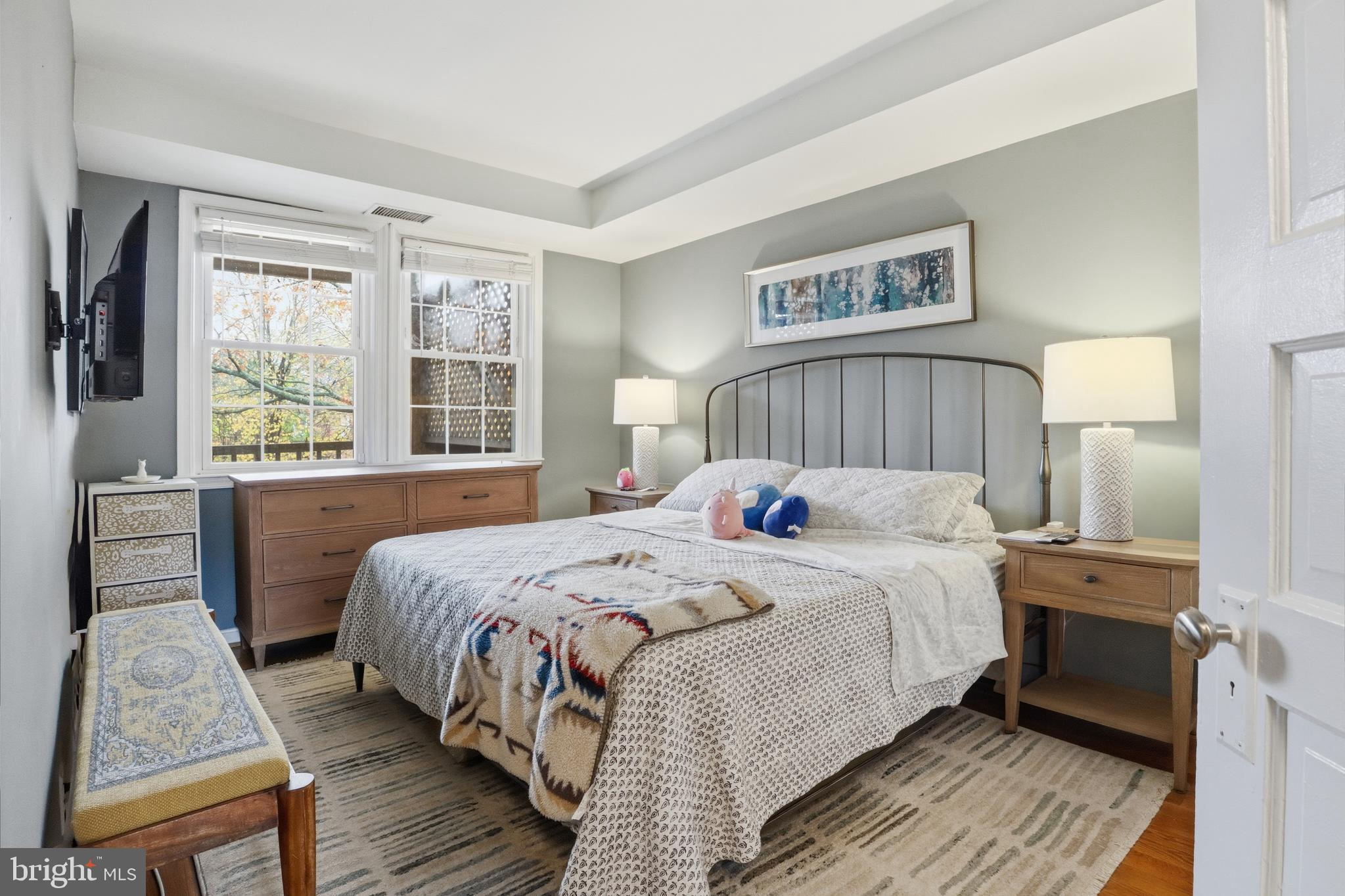 7 Russell Road, Unit D Alexandria, VA 22301 - Photo 16 of 27 a bedroom with a bed and a large window