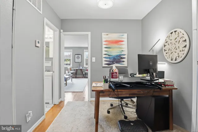 a view of a workspace with furniture