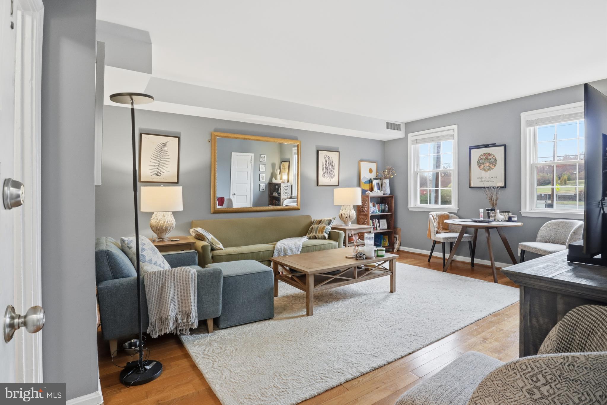 7 Russell Road, Unit D Alexandria, VA 22301 - Photo 4 of 27 a living room with furniture rug and window