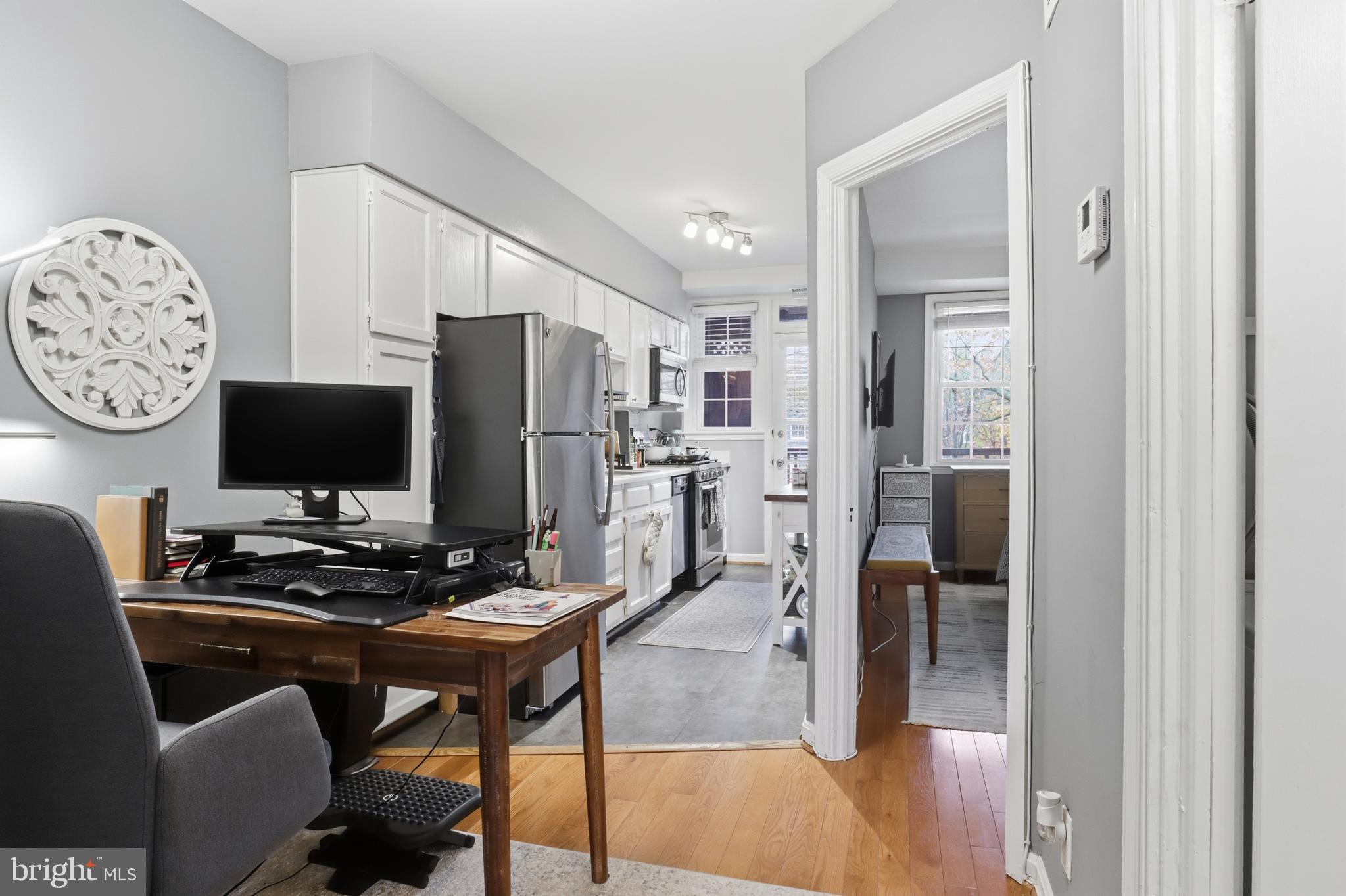 7 Russell Road, Unit D Alexandria, VA 22301 - Photo 8 of 27 a kitchen with stainless steel appliances a refrigerator and a stove top oven