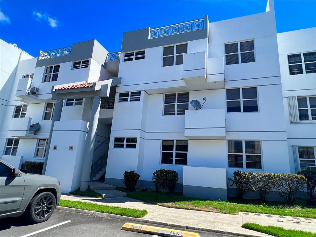 a view of a car park in front of a building