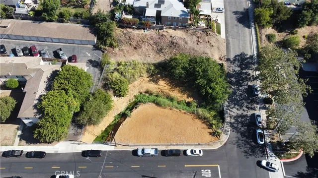 an aerial view of a house with a yard and garden
