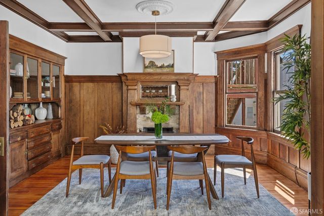 a dining room with furniture and window