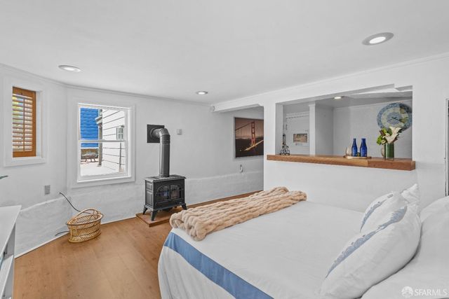 a bedroom with bed and window