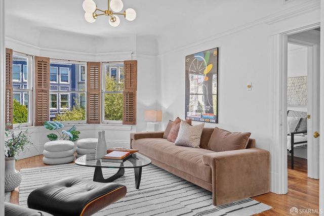 a living room with furniture and windows