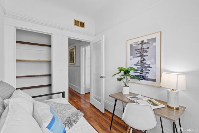 a living room with furniture potted plant and a window