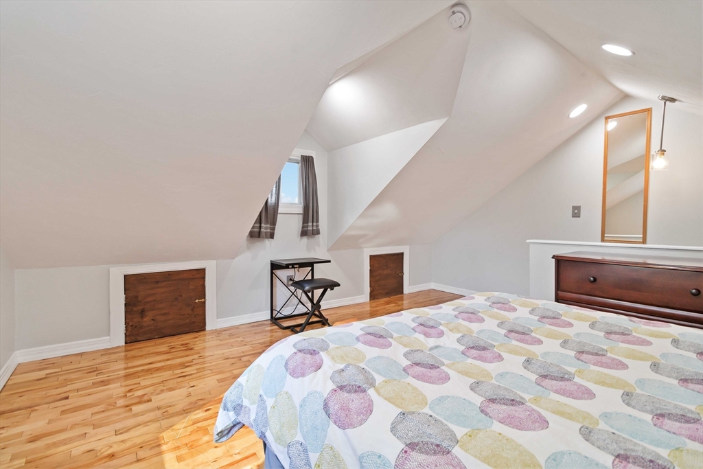 21 A Stowe Road, Unit A Southborough, MA 01772 - Photo 18 of 24 a bedroom with a bed and a dresser