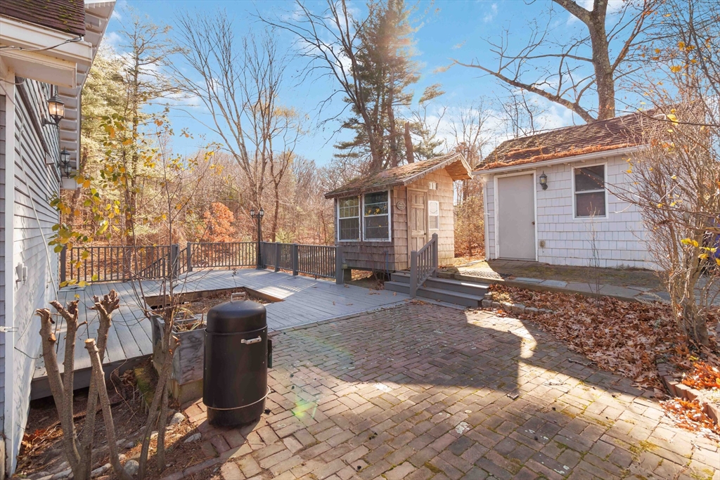 21 A Stowe Road, Unit A Southborough, MA 01772 - Photo 23 of 24 a front view of a house with parking space