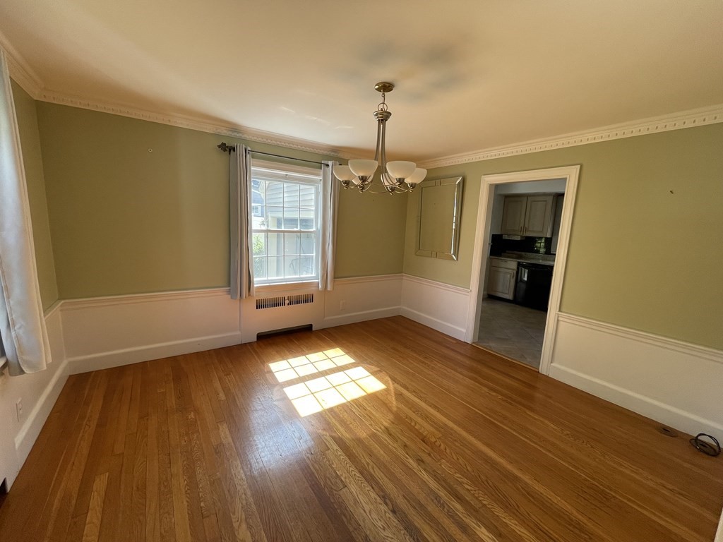 10 Weldon Road Newton, MA 02458 - Photo 16 of 23 wooden floor in an empty room with a window