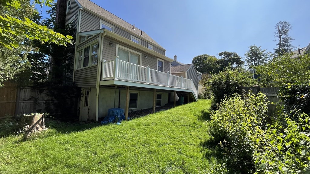 10 Weldon Road Newton, MA 02458 - Photo 17 of 23 a backyard of a house with lots of green space