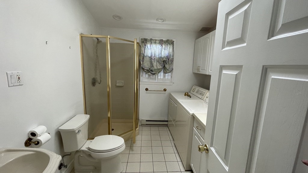 10 Weldon Road Newton, MA 02458 - Photo 18 of 23 a bathroom with a sink toilet and shower
