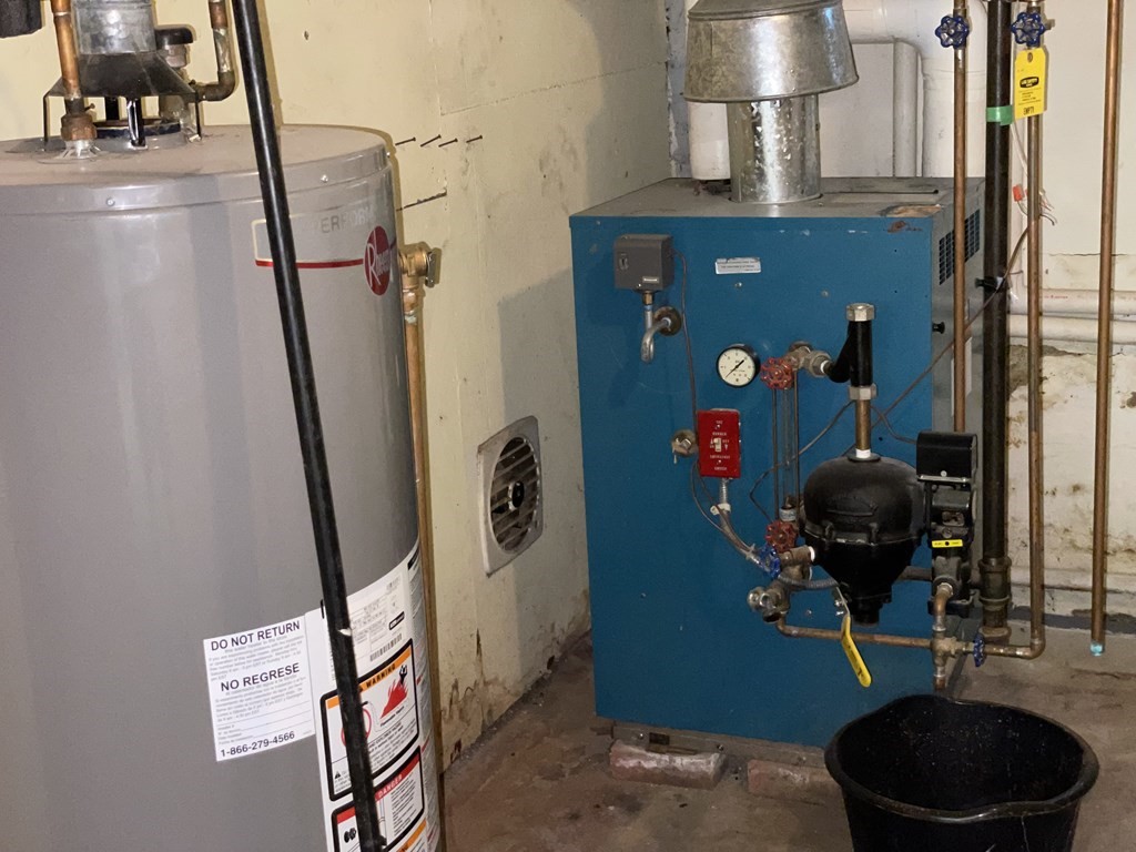 10 Weldon Road Newton, MA 02458 - Photo 19 of 23 a living room with furniture and a fireplace