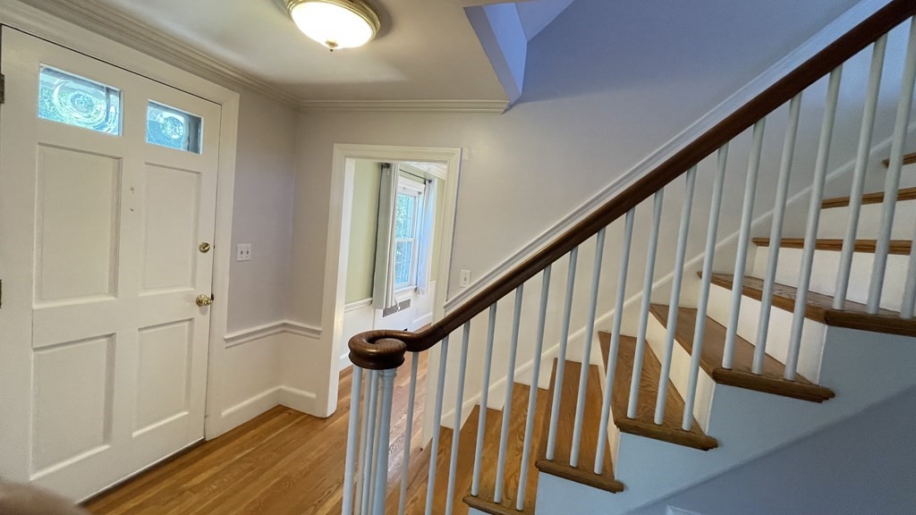 10 Weldon Road Newton, MA 02458 - Photo 20 of 23 a view of entryway with wooden floor and stairs