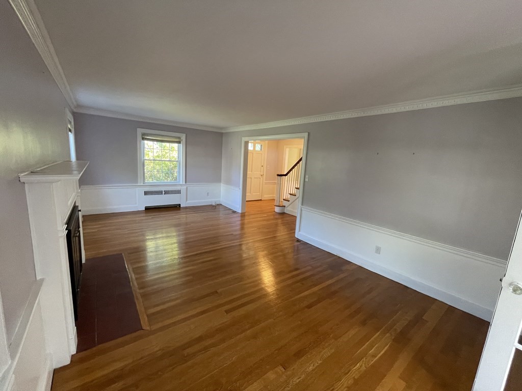 10 Weldon Road Newton, MA 02458 - Photo 6 of 23 wooden floor in an empty room with a window