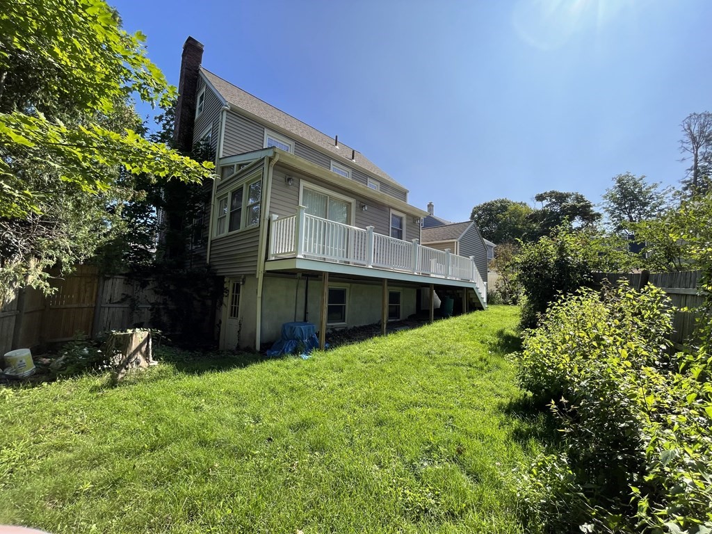 10 Weldon Road Newton, MA 02458 - Photo 9 of 23 a view of a house with a yard plants and large tree