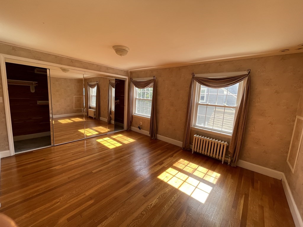 10 Weldon Road Newton, MA 02458 - Photo 10 of 23 wooden floor in an empty room with a window