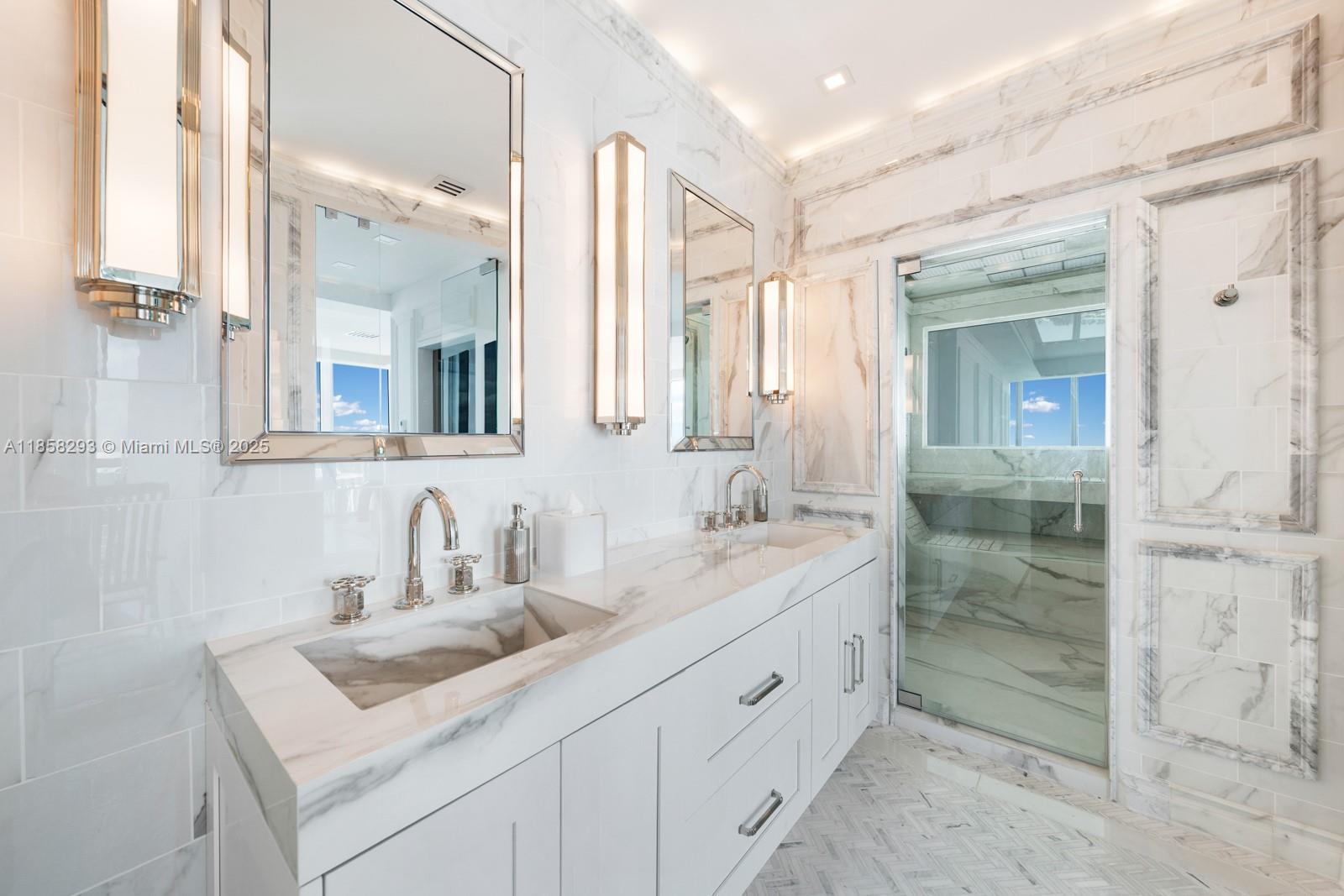 888 Biscayne Boulevard, Unit 5701 Miami, FL 33132 - Photo 18 of 35 a bathroom with a sink shower and a mirror